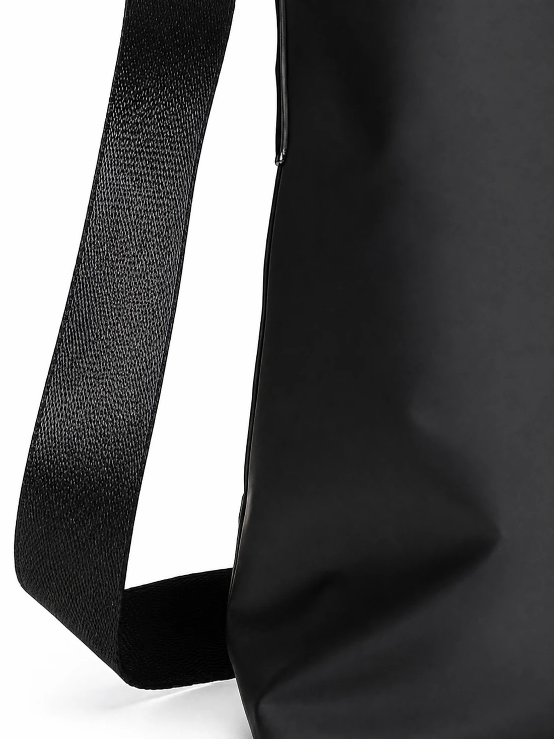 Wide black shoulder strap webbing against the matte shell